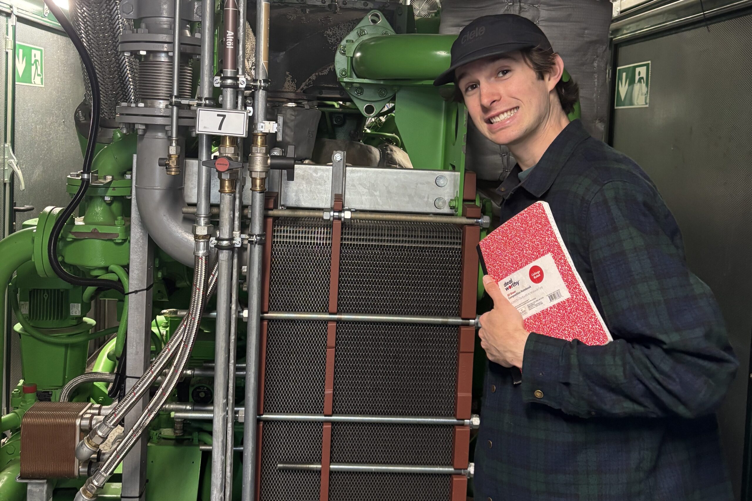 A man standing with a producer-owned 900 kW biogas engine